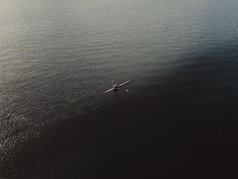 Rowing - aerial view of boat on sea during daytime
