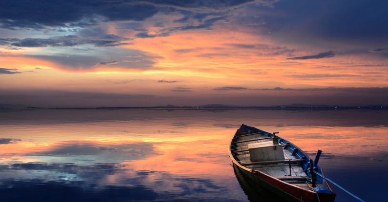 Rowing Boat - Photo of Wooden Boat on Sea