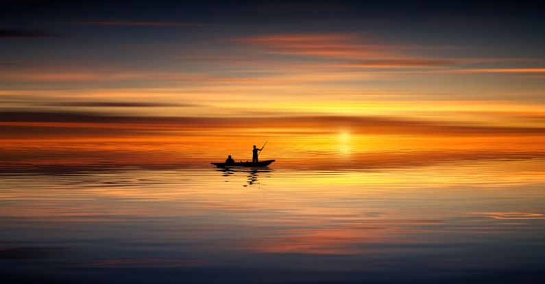 Rowing Boat - Photo of People on Rowboat During Sunset