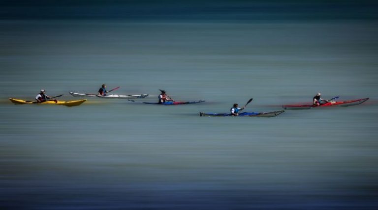 Watercraft - 2 person riding on red kayak on sea during daytime