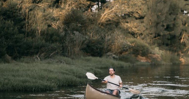 Rowing - Photograph of a Man Kayaking