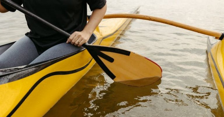 Rowing - With a Paddle in a Yellow Outrigger Canoe