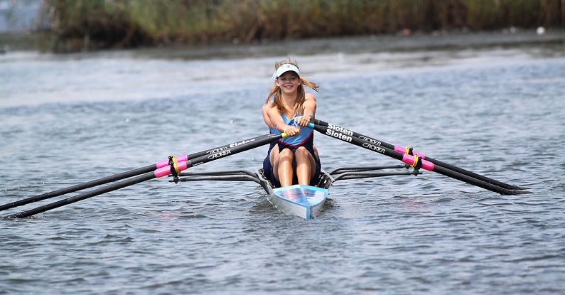 Rowing - Woman Riding Kayak on River