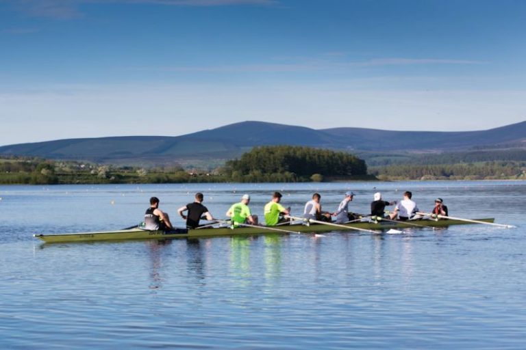 Rowing - people riding on wooden watercraft