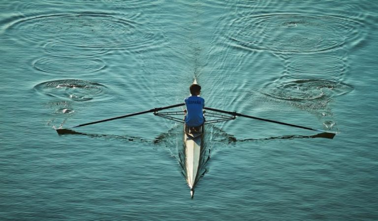 Rowing - person sailing on body of water